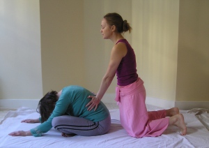 Massaging Pingala and Ida energy lines on the back